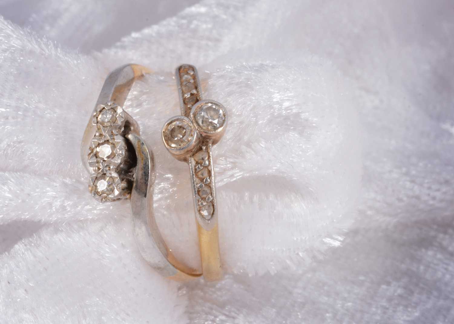 Lot 80 - An 18ct gold diamond and platinum three stone dress ring
