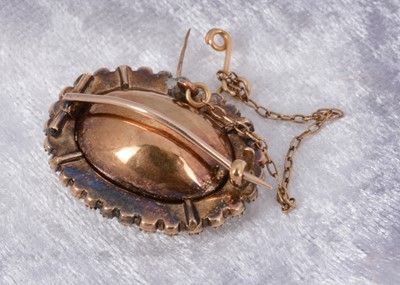 Lot 84 - An oval amethyst and seed pearl foil backed brooch