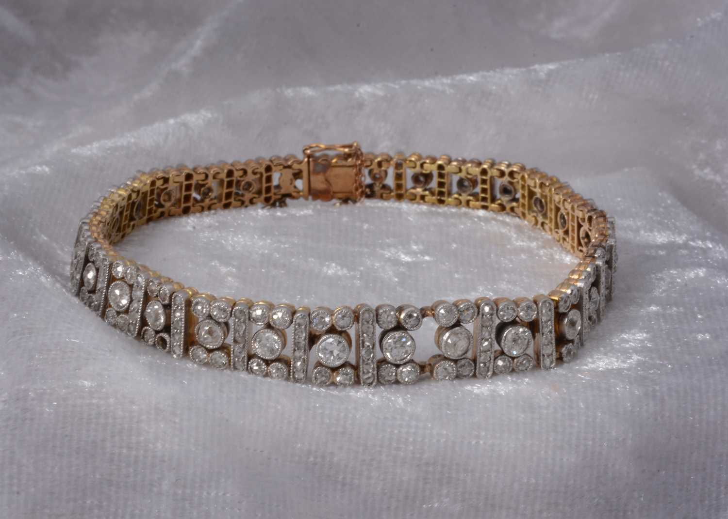 Lot 86 - An art deco old cut diamond line bracelet