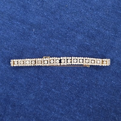 Lot 86 - An art deco old cut diamond line bracelet