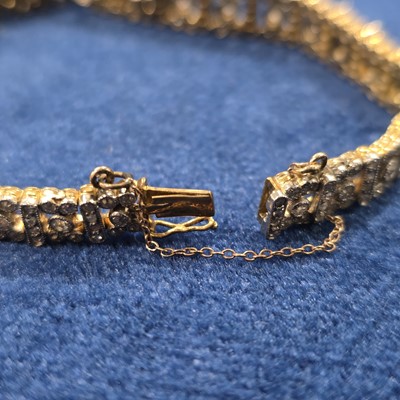 Lot 86 - An art deco old cut diamond line bracelet