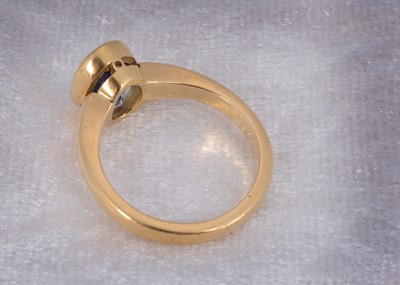 Lot 87 - An 18ct gold single sapphire set dress ring
