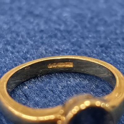 Lot 87 - An 18ct gold single sapphire set dress ring