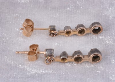 Lot 90 - A pair of Edwardian diamond stud and three drop earrings