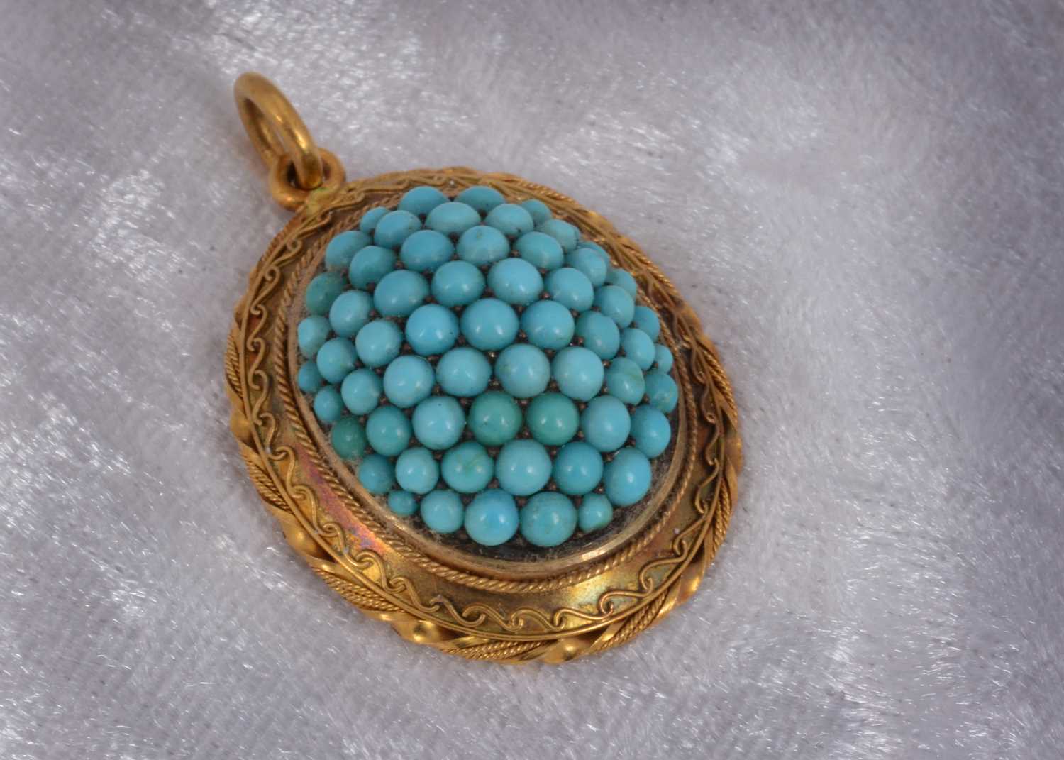 Lot 95 - A 19th Century turquoise, gold locket