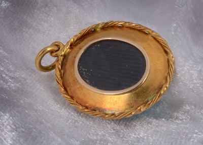 Lot 95 - A 19th Century turquoise, gold locket