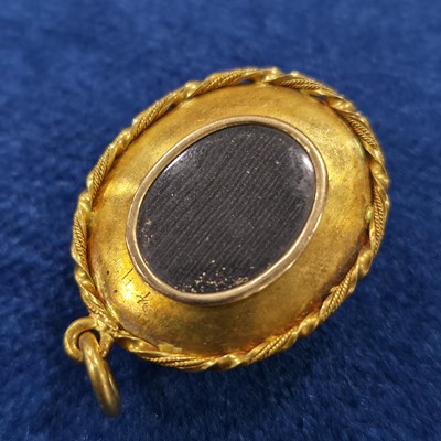 Lot 95 - A 19th Century turquoise, gold locket