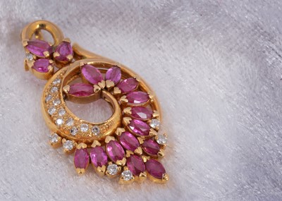Lot 99 - A continental ruby and diamond scroll pendant