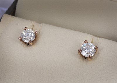 Lot 101 - A pair of diamond stud earrings