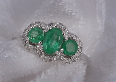 Lot 111 - A continental 14k emerald and diamond dress ring