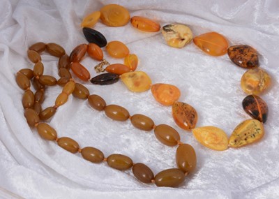 Lot 133 - A string of Baltic and desert amber graduated pebble necklace