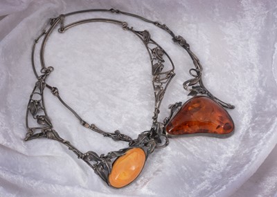 Lot 137 - Two large amber and silver necklaces