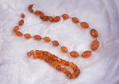 Lot 148 - A string of amber faceted beads