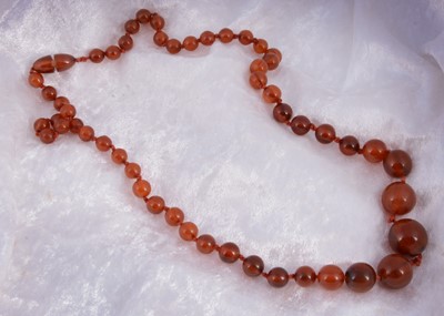 Lot 149 - A string of spherical graduated beads