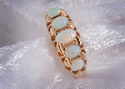Lot 157 - An George V 18ct gold precious opal five stone dress ring