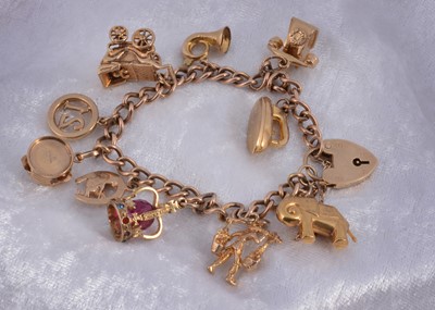 Lot 159 - A 9ct gold curb linked and padlocked clasp charm bracelet