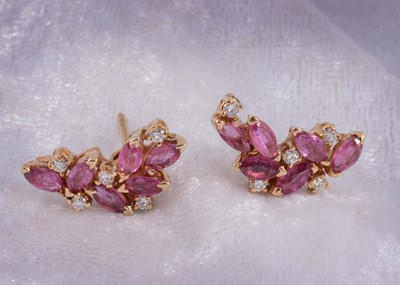 Lot 169 - A pair of ruby and diamond leaf style earrings