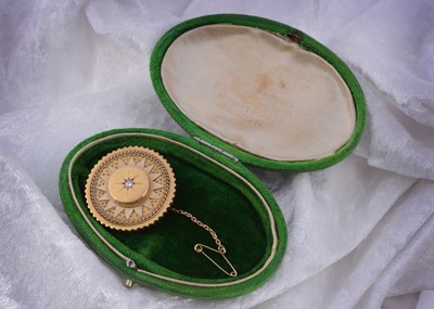 Lot 194 - A 15ct gold and diamond Archaeological Revivalist target brooch