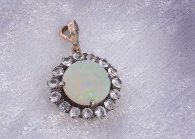 Lot 196 - An opal and white sapphire pendant