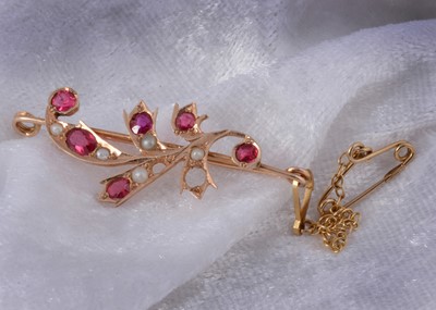 Lot 203 - An Edwardian ruby and seed pearl spray brooch