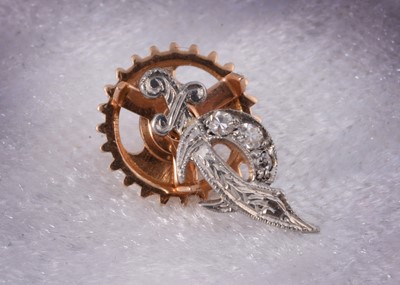 Lot 210 - A 14k marked diamond set lapel pin