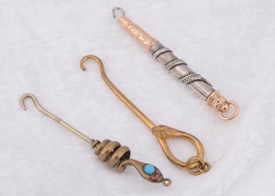 Lot 224 - Three serpent style button hooks