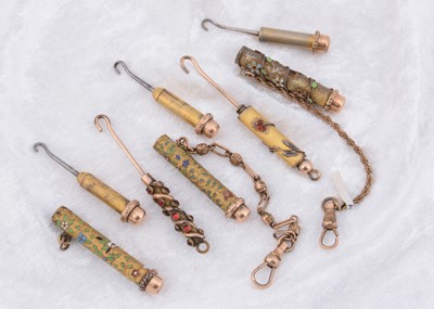 Lot 240 - Five paste gem set and enamel button hooks