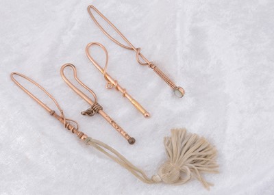 Lot 249 - Four Edwardian gold plated novelty loop button hooks