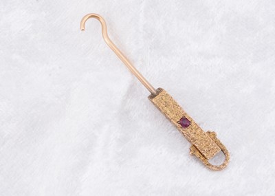 Lot 250 - A Victorian gem set yellow metal button hook