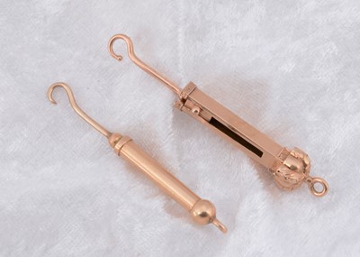 Lot 251 - Two gilt metal retractable fob button hooks