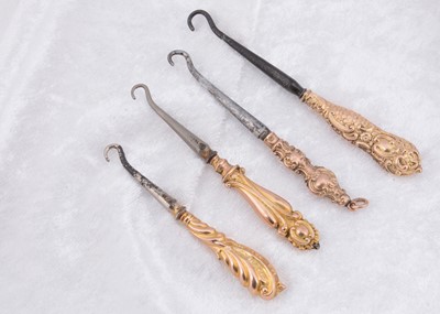 Lot 259 - Four Victorian 9ct gold button hooks
