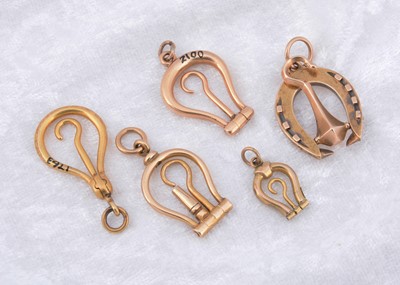 Lot 270 - A collection of miniature folding horseshoe shaped button hooks