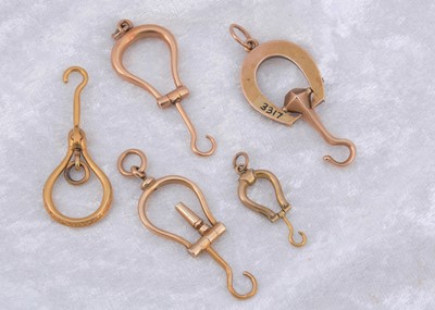 Lot 270 - A collection of miniature folding horseshoe shaped button hooks