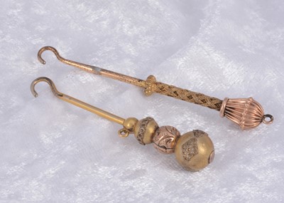 Lot 279 - Two gold plated button hooks