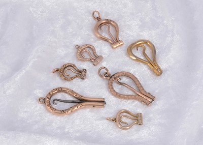 Lot 280 - A collection of seven folding button hooks