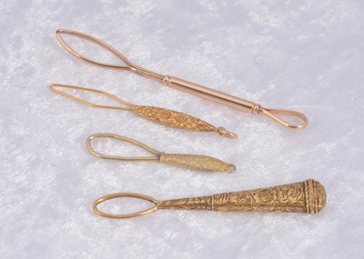 Lot 286 - Four gilt metal button loops