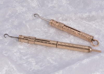 Lot 292 - Two gilt metal sliding button hooks