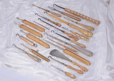 Lot 293 - A collection of gold and silver handled button hooks
