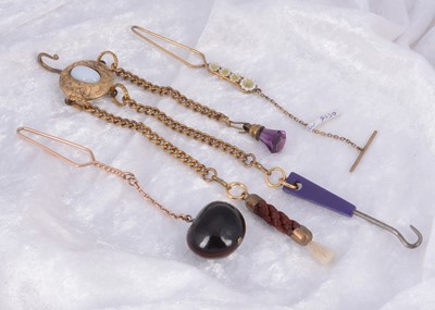 Lot 297 - A collection of gilt metal novelty lapel button hooks