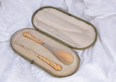 Lot 300 - A Victorian 9ct gold cased button hook and shoehorn set