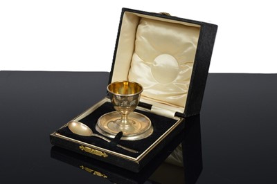Lot 327 - A cased silver filled egg cup and spoon Christening gift set