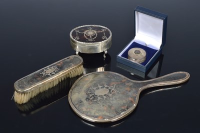 Lot 328 - An Edwardian silver and tortoiseshell oval trinket box