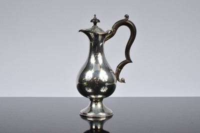 Lot 377 - A George V period silver hot water jug
