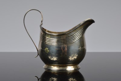 Lot 413 - A George III silver helmet shaped milk jug by Crispin Fuller