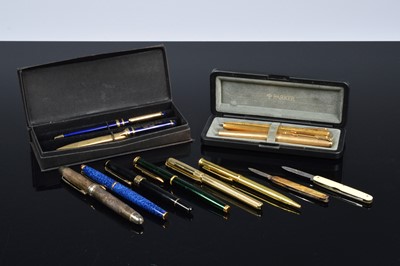 Lot 414 - A small collection of pens and two pocket knives