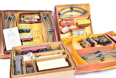 Lot 292 - Two Mettoy 0 Gauge 3-Rail Saftylectric battery operated Train Sets and two Brimtoy clockwork Trains Sets