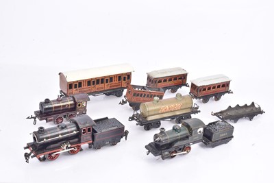 Lot 309 - Bing 0 Gauge clockwork and electric Locomotives and Goods and Passenger Rolling Stock