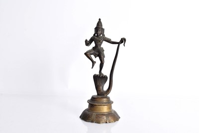Lot 18 - A bronzed figure of the Hindu God Krishna