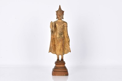 Lot 25 - A bronzed cast metal figure of a Standing Crowned Buddha in Abhayamundra