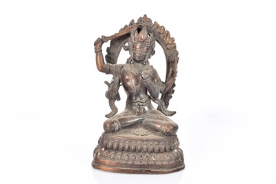 Lot 38 - A bronzed Tibetan Deity
